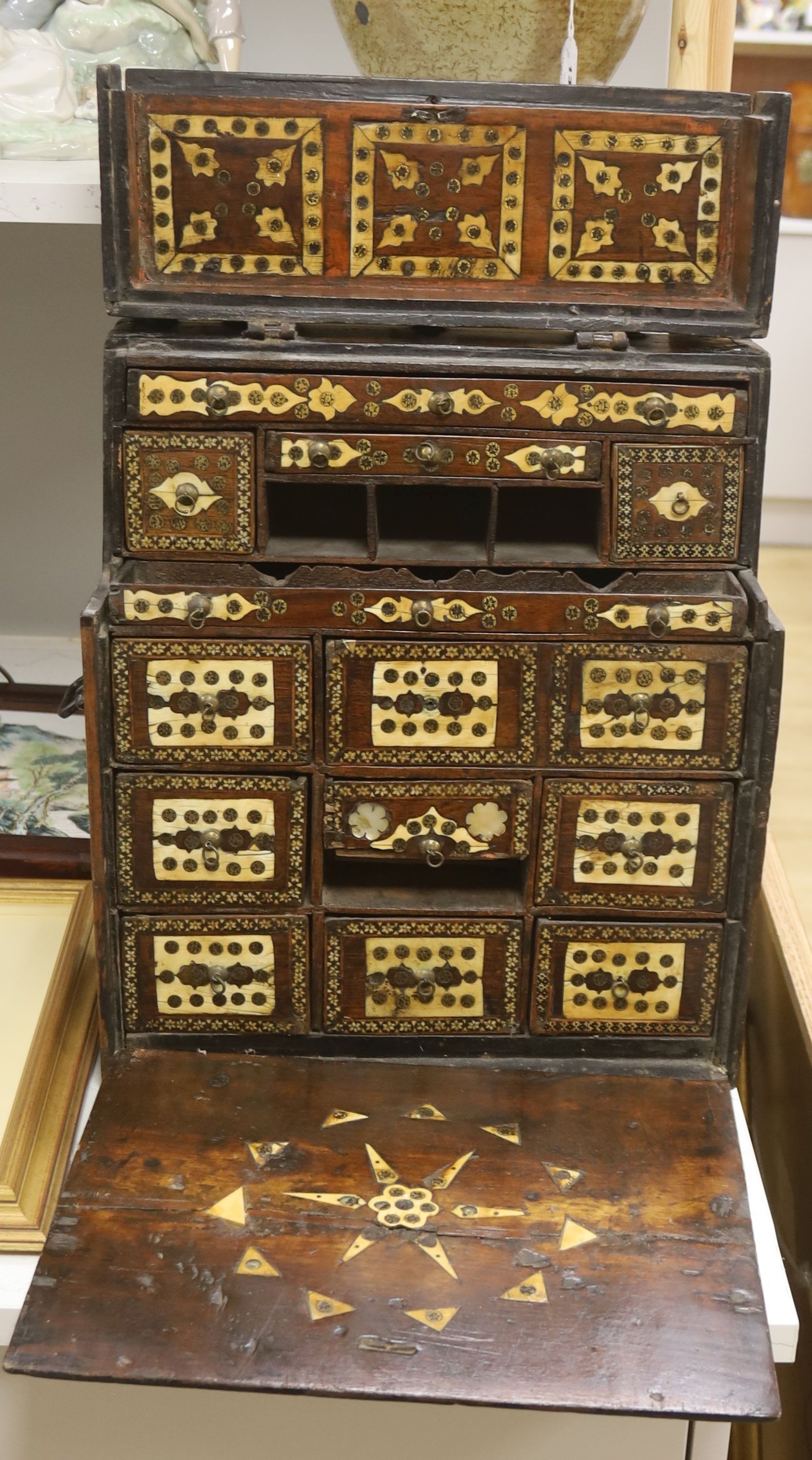 A 17th century Hispano Moresque bone inlaid walnut table cabinet 40cm